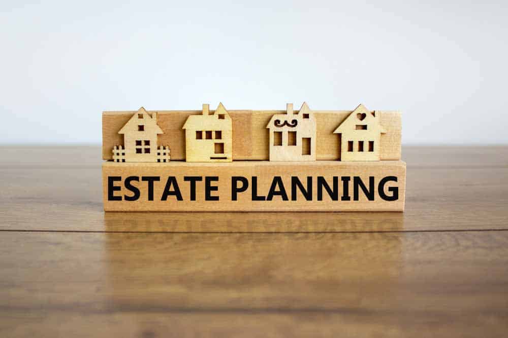 wooden houses with the words estate planning under them