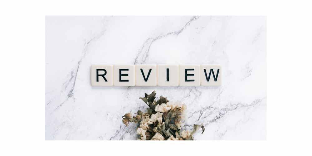 "review" spelled out with scrabble letters