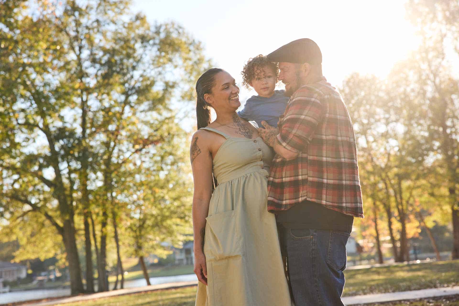 young family, who would benefit from estate planning, in park